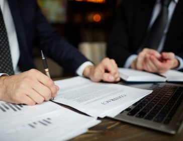 businessman-reading-contract-closeup